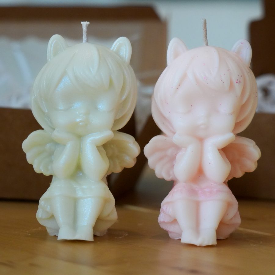 Handmade kawaii angel candles in pastel pink and ivory with wings, perfect for cute home décor or gifting.