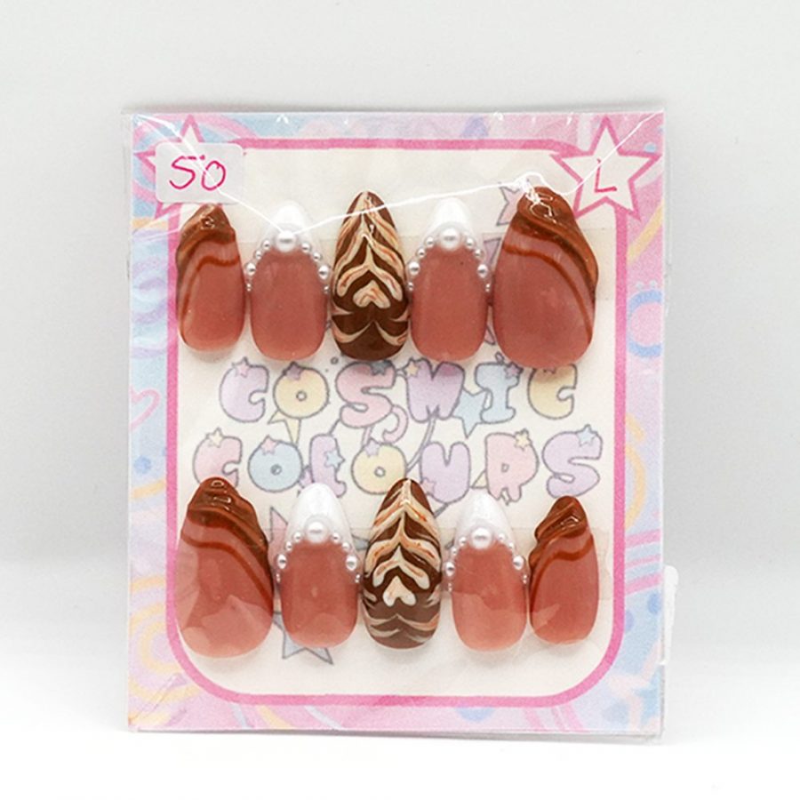 Handcrafted Chai Latte press-on nails in a long almond shape featuring warm neutral tones.